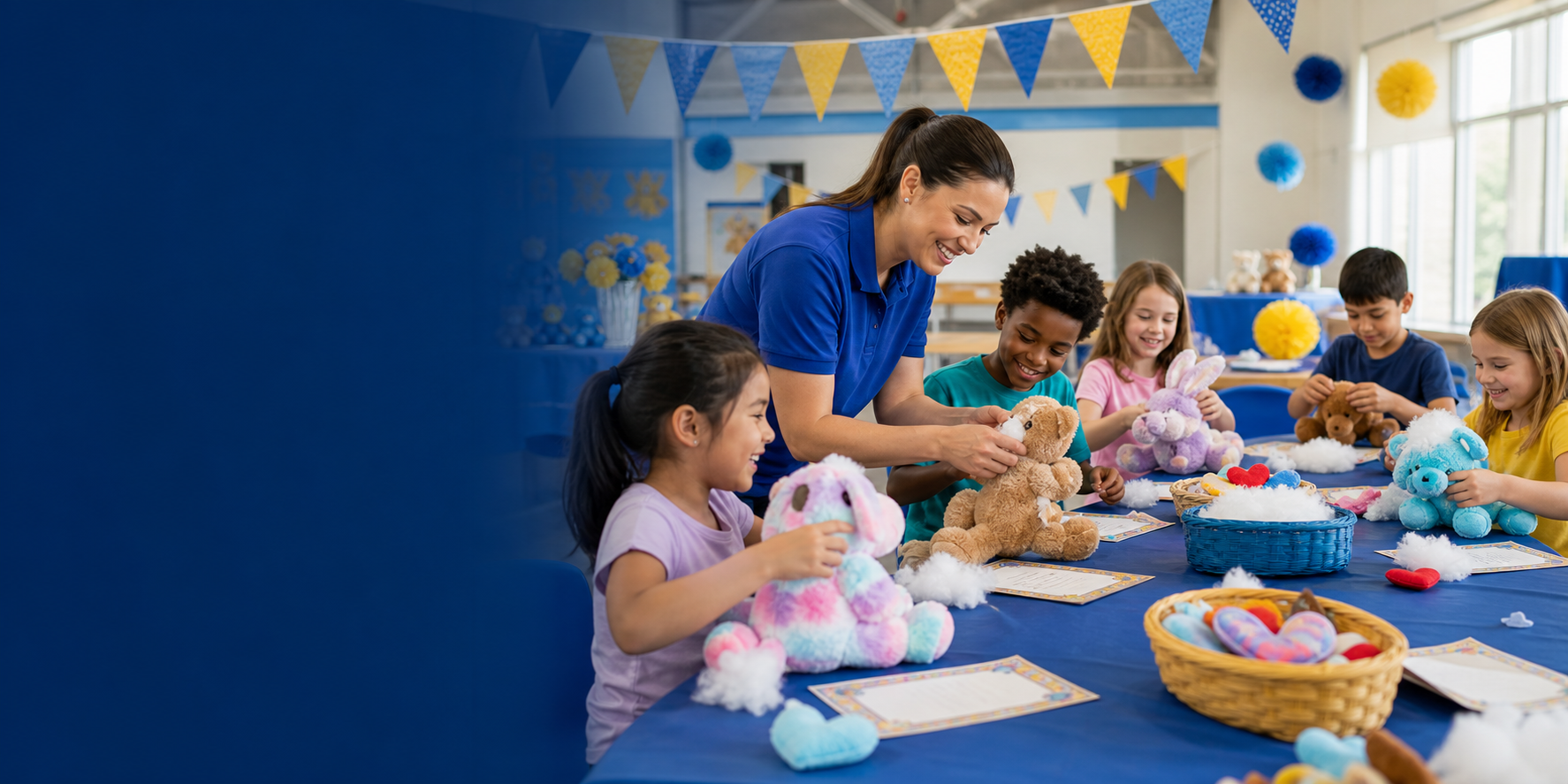 A facilitator helping children create plush animals during a school workshop